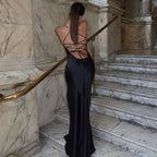 Chic Black Suspender Dress With Tied Waist Charm And Elegance