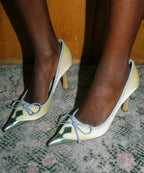 Retro Pink Satin Pointed Toe Pumps With Gold Toe Cap And Yellow Bow Accent Playful Low Heel