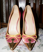 Retro Pink Satin Pointed Toe Pumps With Gold Toe Cap And Yellow Bow Accent Playful Low Heel
