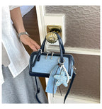 Denim Crossbody Bag With Embroidered Ruched Detailing And Subtle Rivet Accents