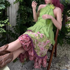 Green Ribbon Chiffon Sleeveless Top With Open Back And Floral Accent