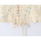 Sunlit Yellow Floral Corset Top With Lace Trim And Delicate Spaghetti Straps