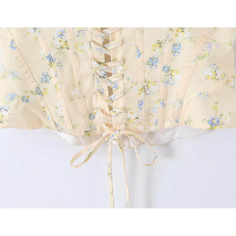 Sunlit Yellow Floral Corset Top With Lace Trim And Delicate Spaghetti Straps