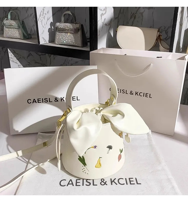 Whisper Bloom Embroidered Floral Bucket Bag With Textured Surface For Everyday Chic And Elegant Casual Carry
