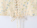Sunlit Yellow Floral Corset Top With Lace Trim And Delicate Spaghetti Straps