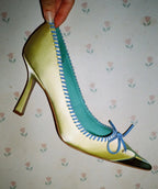 Retro Pink Satin Pointed Toe Pumps With Gold Toe Cap And Yellow Bow Accent Playful Low Heel