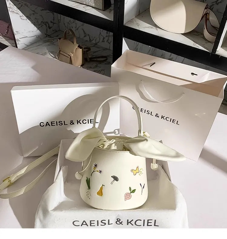 Whisper Bloom Embroidered Floral Bucket Bag With Textured Surface For Everyday Chic And Elegant Casual Carry