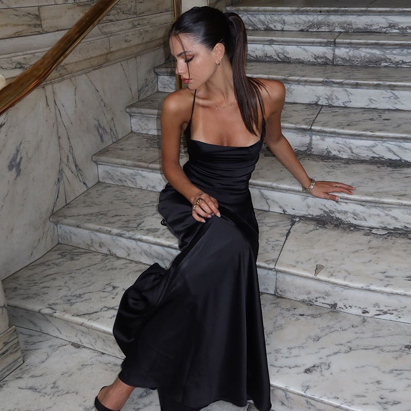 Chic Black Suspender Dress With Tied Waist Charm And Elegance